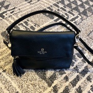 Kate Spade black flap pebbled leather purse.